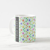 Farbenfrohe Blume, hellgrüner Hintergrund, schwarz Kaffeetasse (Vorderseite Links)
