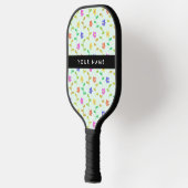 Farbenfrohe Blume, hellgrüner Hintergrund, schwarz Pickleball Schläger (Links)