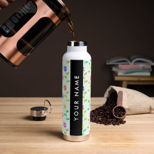 Farbenfrohe Blume, hellgrüner Hintergrund, schwarz Trinkflasche