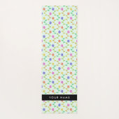 Farbenfrohe Blume, hellgrüner Hintergrund, schwarz Yogamatte (Rückseite)