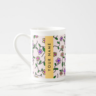 Farbenfrohe Blumen, rosa Hintergrund, gelb Porzellantasse