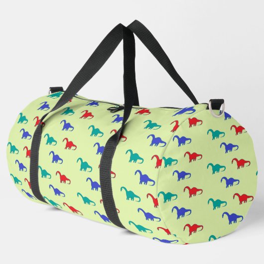 Farbenfrohe Dinosaurier-Muster auf grün Duffle Bag (Linke Ecke)