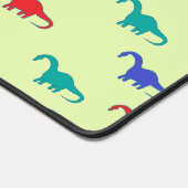 Farbenfrohe Dinosaurier-Muster auf grün Schreibtischunterlage (Ecke)