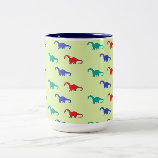 Farbenfrohe Dinosaurier-Muster auf grün Zweifarbige Tasse (Mittel)