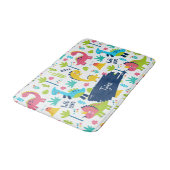 Farbenfrohe Dinosaurier Muster mit Kindername Bade Badematte (Schrägansicht)