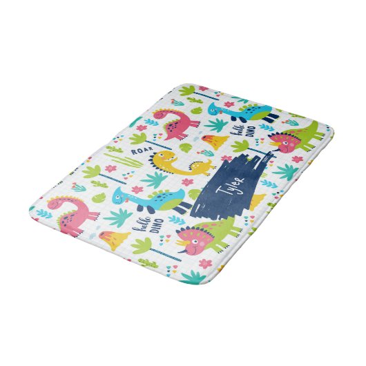 Farbenfrohe Dinosaurier Muster mit Kindername Bade Badematte (Schrägansicht)
