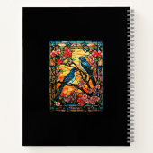 Farbenfrohe, festgeklemmte Glasvögel auf blühenden Notizblock (Rückseite)