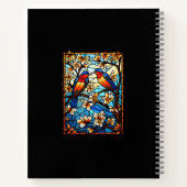 Farbenfrohe, festgeklemmte Glasvögel auf blühenden Notizblock (Rückseite)