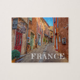 Farbenfrohe französische Hügellandschaftsstadt Puzzle