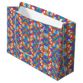 Farbenfrohe geometrische Geschenktasche mit lebend Große Geschenktüte (Vorderseite Schrägansicht)