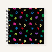 Farbenfrohe gestrichene Paw-Prints auf schwarz Notizblock (Vorderseite)