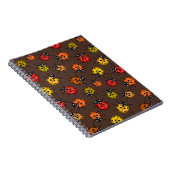 Farbenfrohe Ladybugs auf braun Notizblock (Rechte Seite)