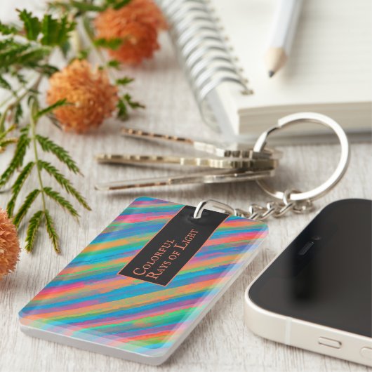 Farbenfrohe Lichtstrahlen fallen in Dunkelheit Schlüsselanhänger (Vorderseite rechts)