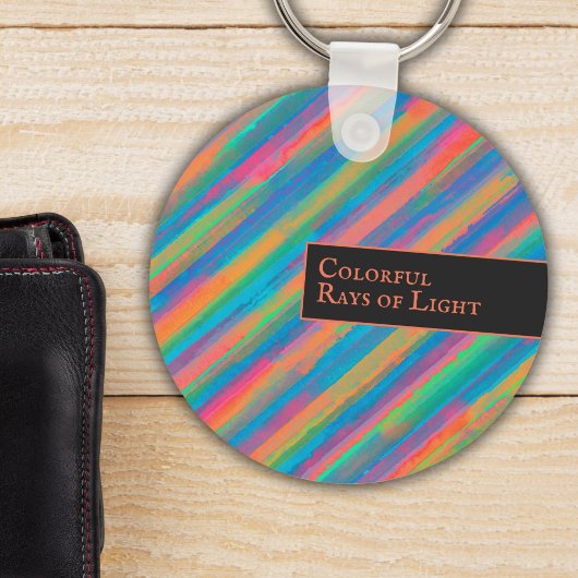 Farbenfrohe Lichtstrahlen fallen in Dunkelheit Schlüsselanhänger