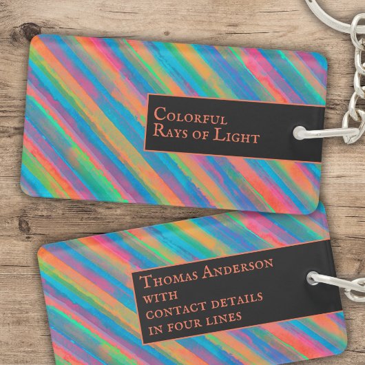 Farbenfrohe Lichtstrahlen fallen in Dunkelheit Schlüsselanhänger