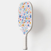 Farbenfrohe rosa blaue Garden-Blume mit benutzerde Pickleball Schläger (Links)