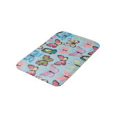 Farbenfrohe Schmetterlingsmuster Pastellblau Badematte (Schrägansicht)