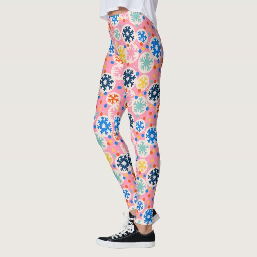 Farbenfrohe Schneeflocken im rosa Urlaubsmuster Leggings (Links)