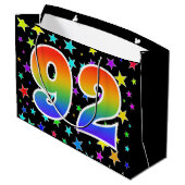 Farbenfrohe Sterne + Regenbogenmuster "92" Event # Große Geschenktüte (Rückseite Schrägansicht)