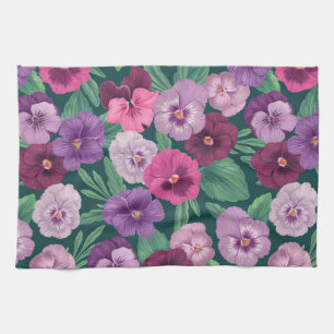 Farbenfrohe Stiefmütterchen auf dunkelgrünblau Geschirrtuch