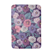 Farbenfrohe Stiefmütterchen auf tiefviolett Badematte (Vorderseite Vertikal)