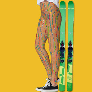 Farbenfrohe Vintage-Skier auf hellbraunem Muster Leggings
