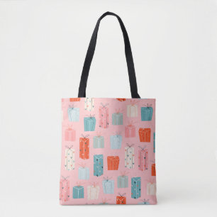 Farbenfrohe Weihnachtsgeschenke auf einem rosa Hin Tasche
