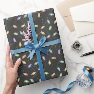 Farbenfrohe Weihnachtslichter auf schwarzem Gewand Geschenkpapier