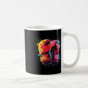 Farbige bemalte Boxhandschuhe beim künstlerischen  Kaffeetasse