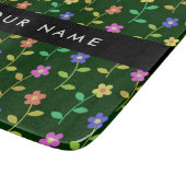 Farbige Blume, grüner Hintergrund, schwarz Schneidebrett (Ecke)