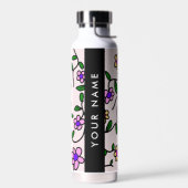 Farbige Blume, rosa Hintergrund, schwarz Trinkflasche (Links)