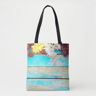 Farbige Blumen, antike Holzgrenze. Tasche