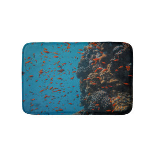 Farbige Fische und Riffe Badematte