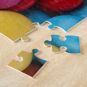 Farbige Knöpfe mit Süßschokolade Puzzle (Seite)