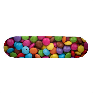 Farbige Schokoladenschaltflächen Skateboard