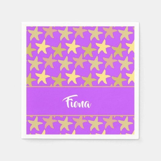 Farbige Seesterne auf lila Serviette (Vorderseite)