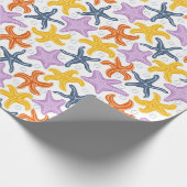 Farbige Seesterne auf Weiß Geschenkpapier (Ecke)