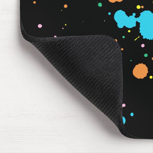 Farbige Spritzer auf schwarz Mousepad (Ecke)