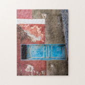 Farbige Wand mit blauer Tür Puzzle (Vertikal)