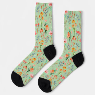 Farbige Wildblumen in Aquarell auf grün Socken