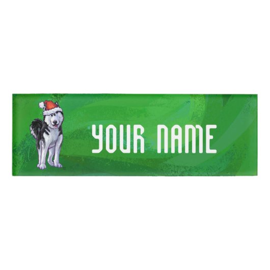 Feiernder Husky in Weihnachtsmannmütze auf Green Namenschild (Vorderseite)