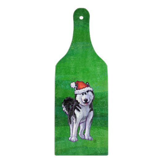 Feiernder Husky in Weihnachtsmannmütze auf Green Schneidebrett (Vorderseite)