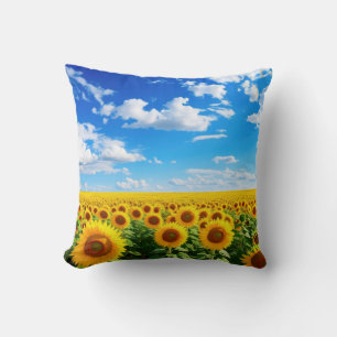 Feld der Sonnenblumen unter blauem Himmel, lebendi Kissen
