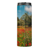 Feld mit Blume und Bäumen Thermosbecher (Rückseite)