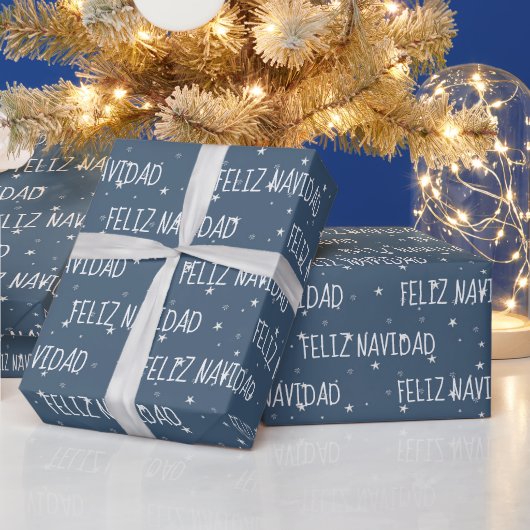 Feliz Navidad mit Sternen auf blau Geschenkpapier (Feiertage)