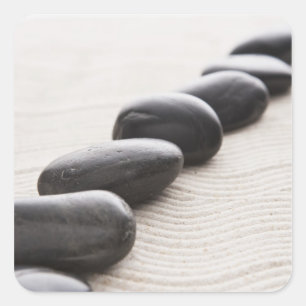 Felsen auf Sand Quadratischer Aufkleber