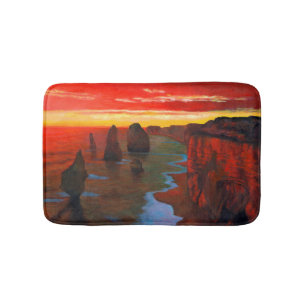Felsige Küste am Sonnenuntergang Badematte