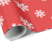 Festes Schneeflockenmuster im roten Hintergrund Geschenkpapier (Rolleneckpunkt)