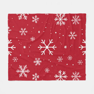 Festive red background with white snowflakes fleecedecke