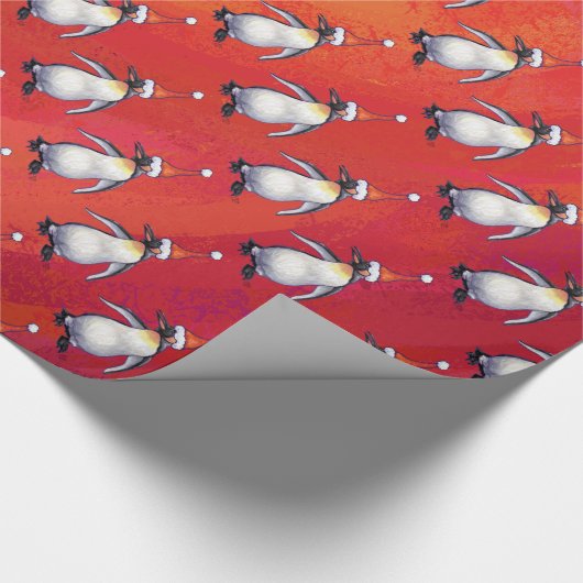 Festlicher Pinguin in einer Weihnachtsmannmütze Geschenkpapier (Ecke)